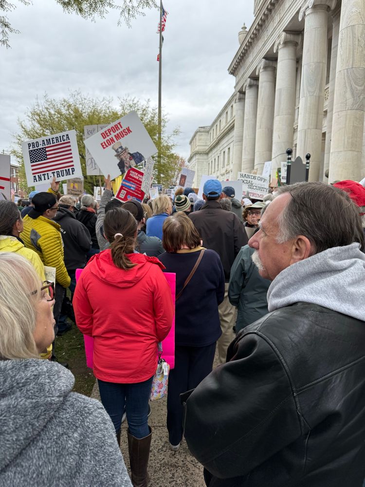 People in front of courthouse with protest signs