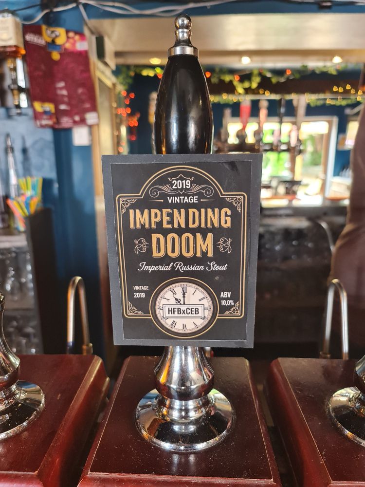 Pump clip for Impending Doom Imperial Russian Stout beer, matured since 2019, available at the Pomfret Arms pub, Northampton