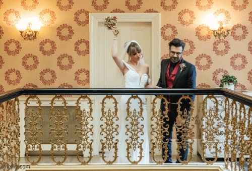 gif of my husband and I on our wedding day doing a silly dance for attendees below