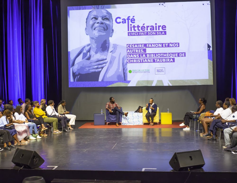 Alain Serge Agnessan and Christiane Taubira on a stage at the Abidjan International Book Fair.