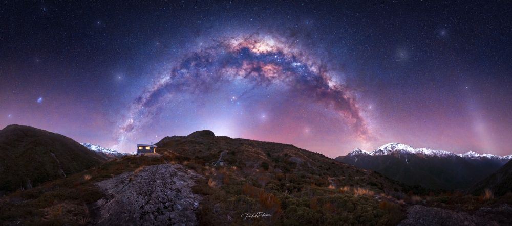 The Zodiacal Light rising from behind the centre ridge line underneath the Milky Way and the Gegenschein to the far right. 
This image was in the top 25 Milky Way Photographer of the Year 2024. 