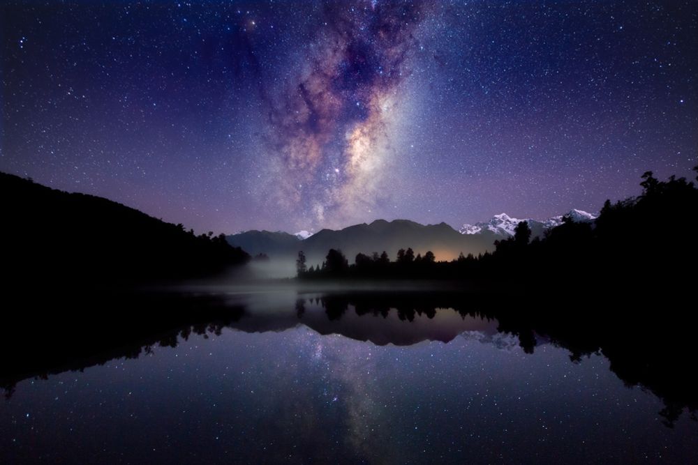 ✨The rising Milky Way 
📍Lake Matheson | West Coast | NZ

EXIF: Canon 6D | Sigma Art 20mm 
Untracked standard panorama | 20 images 
f/2.8 | 15 seconds | ISO 10,000
Global adjustments in Lightroom 
Stitched with PTGui
Final edits in Photoshop 