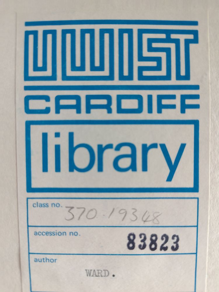 A label from inside a former library book. It has a UWIST logo in blue ink in distinctive rectangular type very redolent of 1970's design.