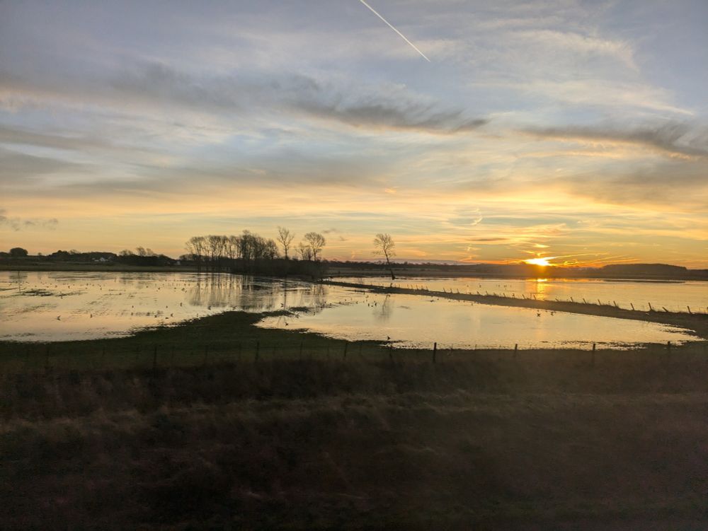 Photo of sunrise over fields 