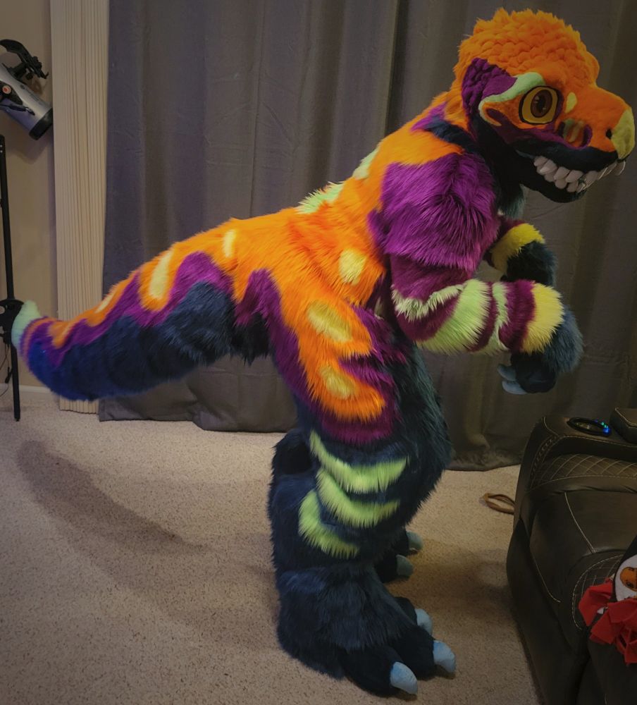 Amazing dino suit! I mean...dark blue, purple, orange, and yellow dinosaur fursuit
