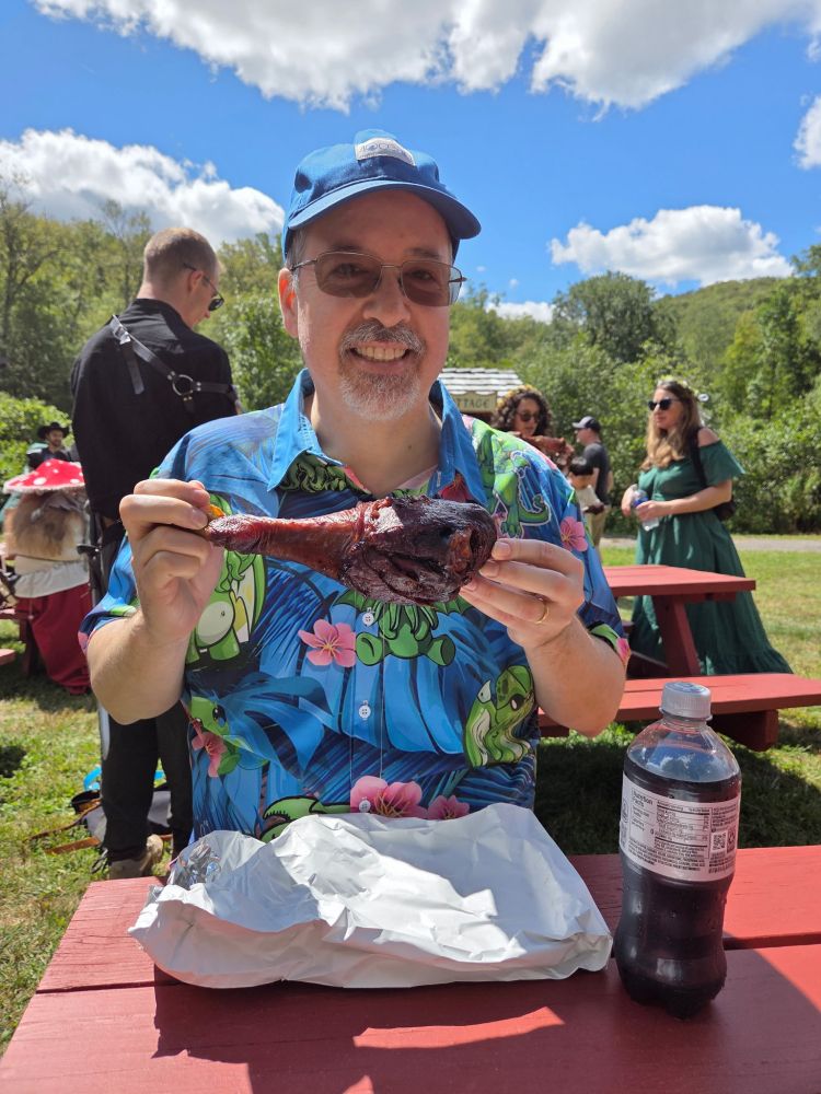 Me holding a giant turkey leg.