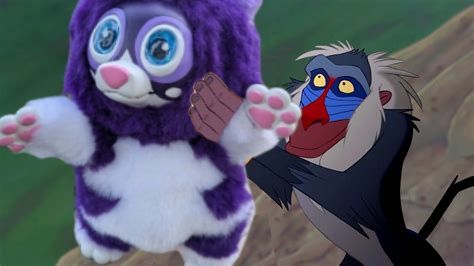 Badly edited image of Rafiki holding up Simba, except that he's lifting the Ladoodoo instead