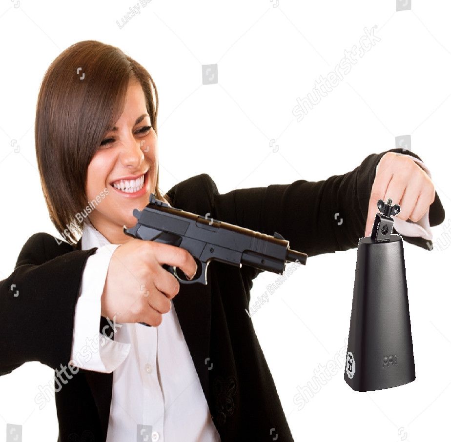 A badly-edited stock photo of a woman holding a cowbell in one hand and shooting it at point blank range with the gun she's holding in her other hand. She's smiling like she's having a lot of fun.