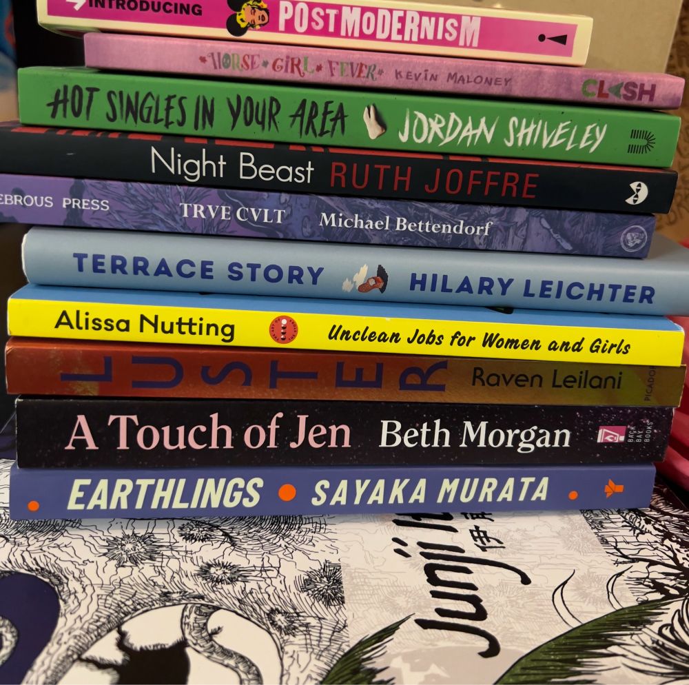 Stack of books: Introducing Post-Modernism, Horse Girl Fever by Kevin Maloney, Hot Singles in Your Area by Jordan Shiveley, Night Beast by Ruth Joffre, Trve Cvlt by Michael Bettendorf, Terrace Story by Hilary Leichter, Unclean Jobs for Women and Girls by Alissa Nutting, Luster by Raven Leilani, A Touch of Jen by Beth Morgan, Earthlings by Sayaka Murata, a Junji Ito coloring book.