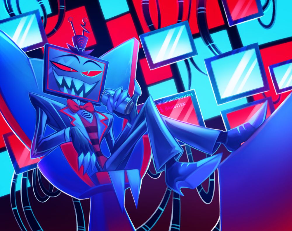 vox in his office, sitting on his office chair, watching something he probably shouldn't be watching, get your feet off console you man child