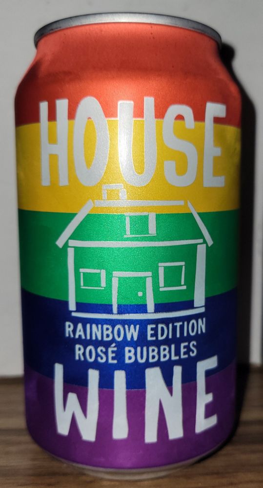 A soda can with a rainbow design and the words "House Wine" and "Rainbow Edition Rosé Bubbles" along with a stick drawing of a house.
