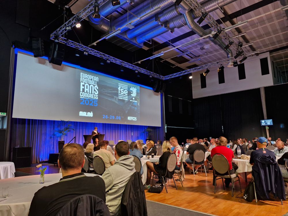 Image description: The main conference room of the EFFC. Multiple tables with delegates looking at the stage.