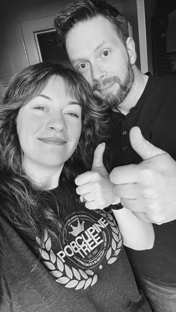 Miri and George from Working Classicists looking cheerful and giving a thumbs up