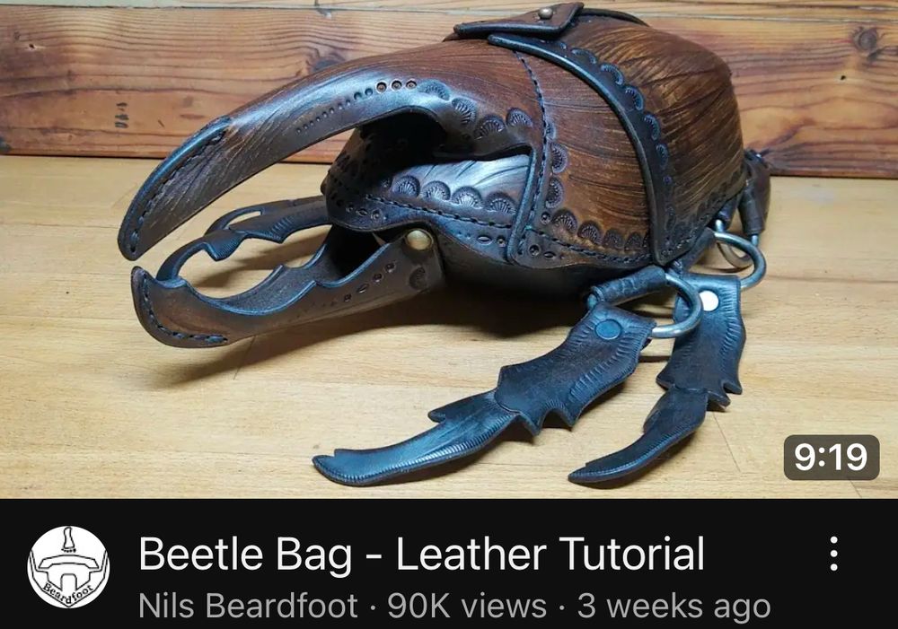 Youtube Thumbnail: Beetle Bag - Leather Tutorial by Nils Beardfoot
It’s a large scarab beetle that functions as a handmade bag