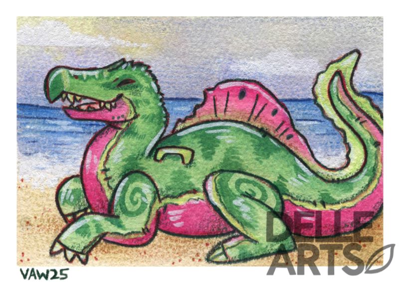 A watermelon spinosaurus floatie sitting on a beach enjoying the sun. 