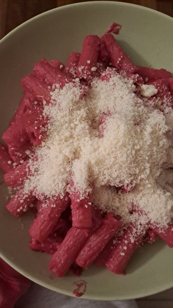 Pasta with the pink hummus and cheese on top