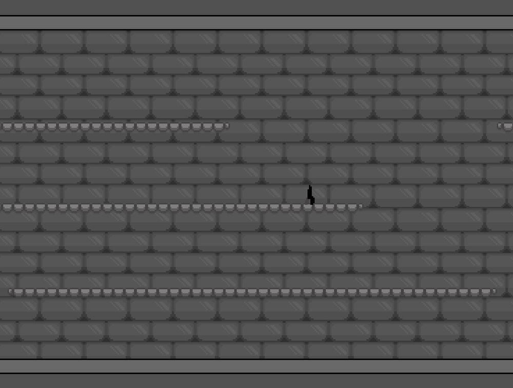 A black and white image of a player character standing on some gray brick platforms. There is a gray brick wall behind.