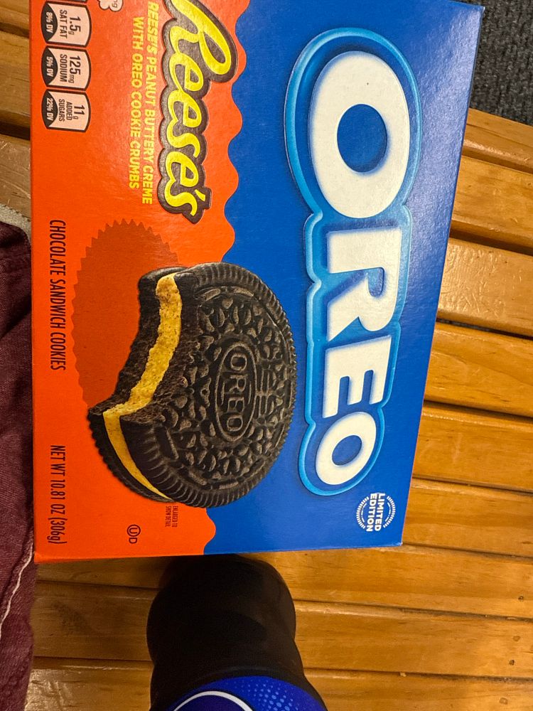Picture of the Reese’s Oreos on a bench next to a Pepsi 