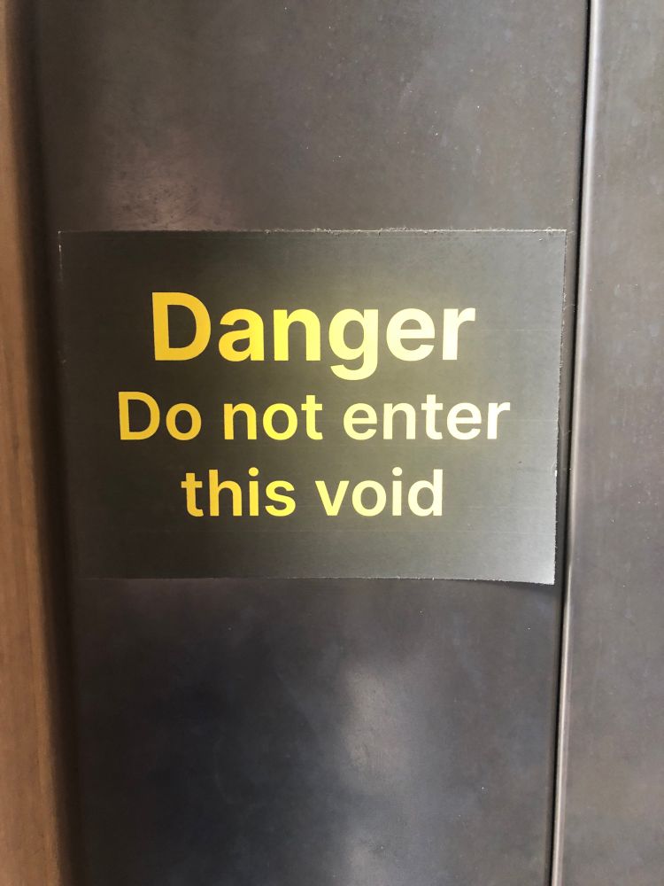 Photo of notice saying “Danger Do not enter this void”