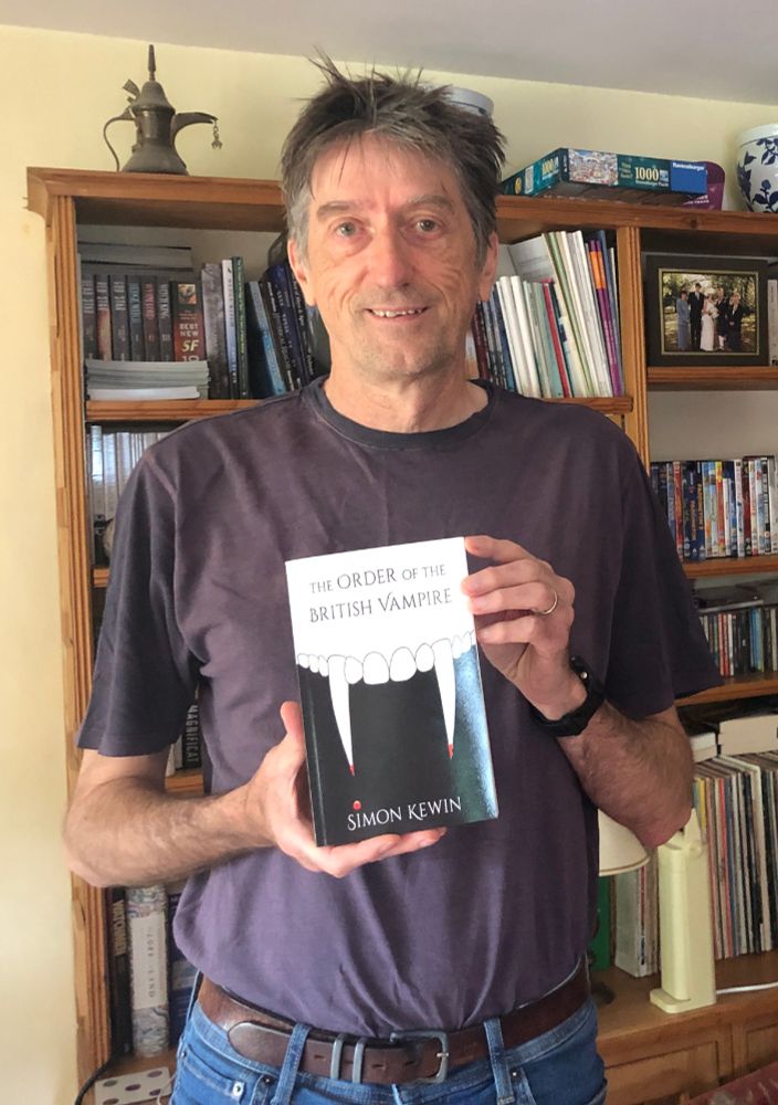 The author holding the paperback of The Order of the British Vampire.