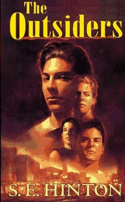 Cover of a book titled "The Outsiders" by S.E. Hinton. The picture depicts 4 young boys overlapping each other over a very orange town.