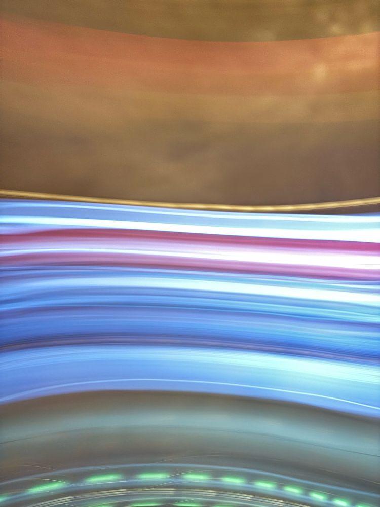 horizontal sweeps of color, ranging from orange-brown to blues to sort of jade greens, with one purple-ish stripe center stage