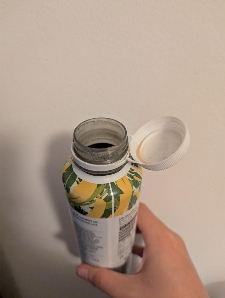 huel bottle with the cap tied to the side