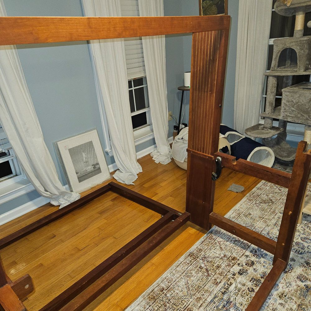 The bare frame of an 8 shaft loom, with all pieces removed for cleaning.
