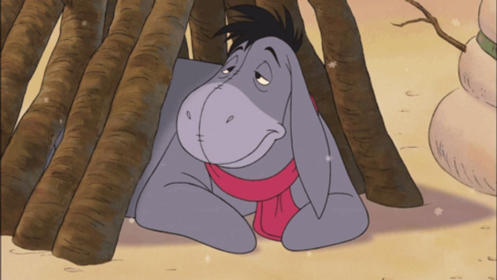 eeyore from winnie the pooh wearing a scarf