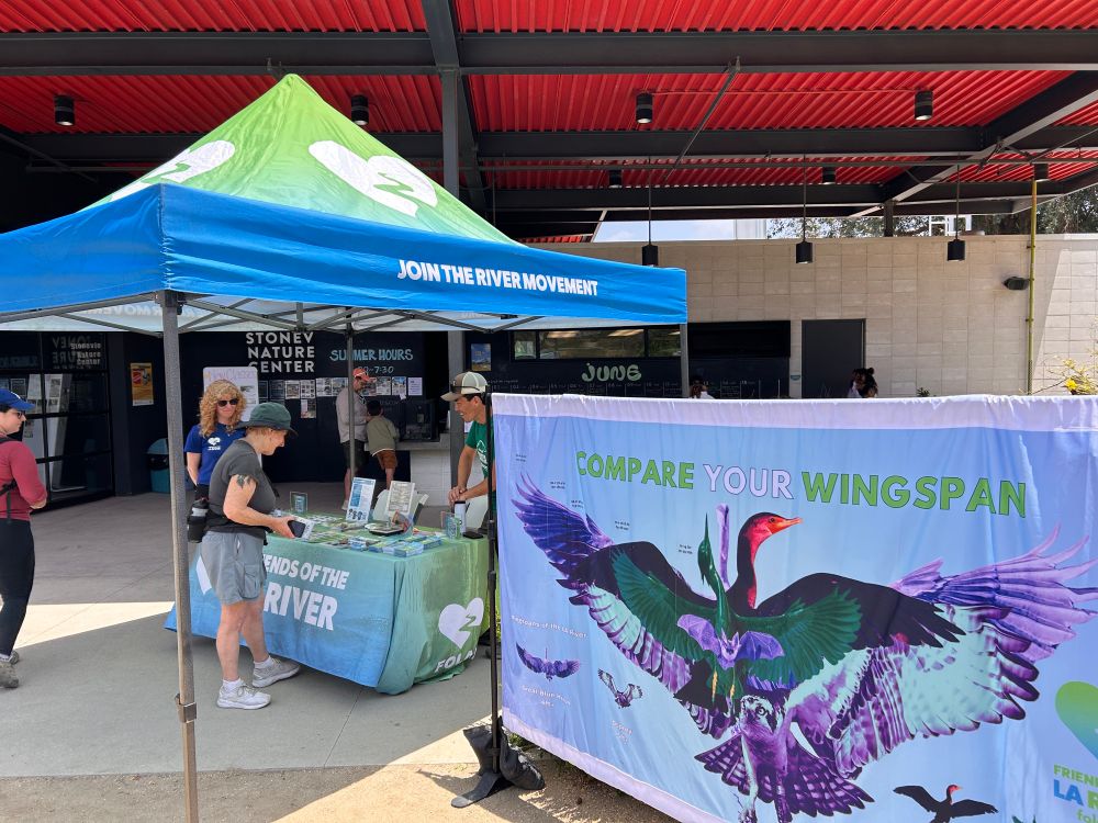 Picture of booth with river school resources. 