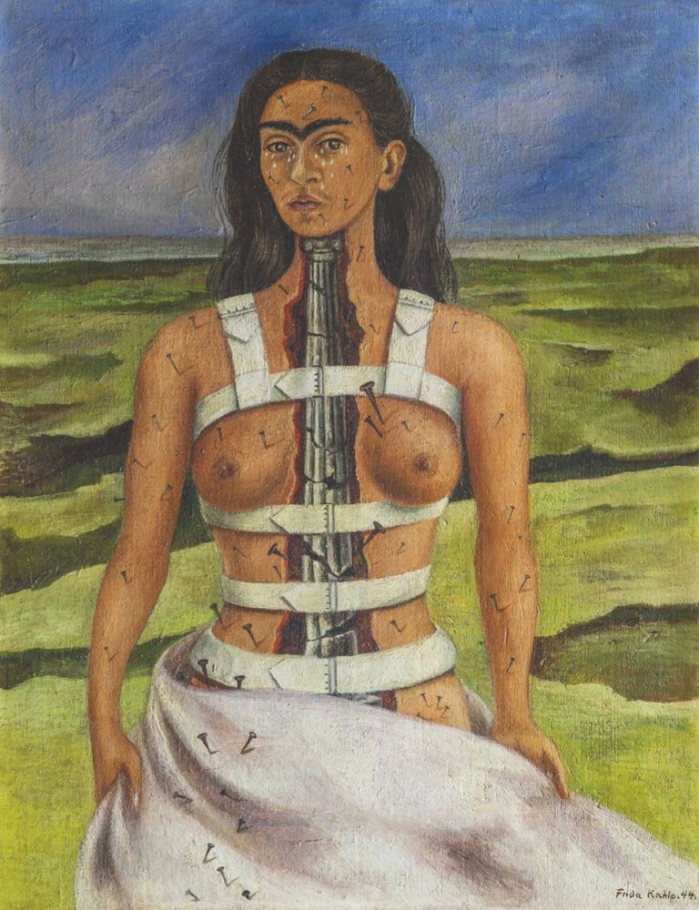 A woman wearing a back brace with bare breasts and a stone column in the centre of her body
