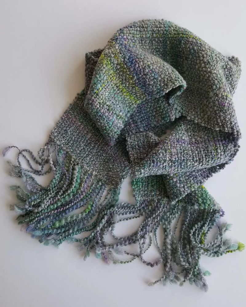 Hand spun merino silk fibre woven in to a scarf.