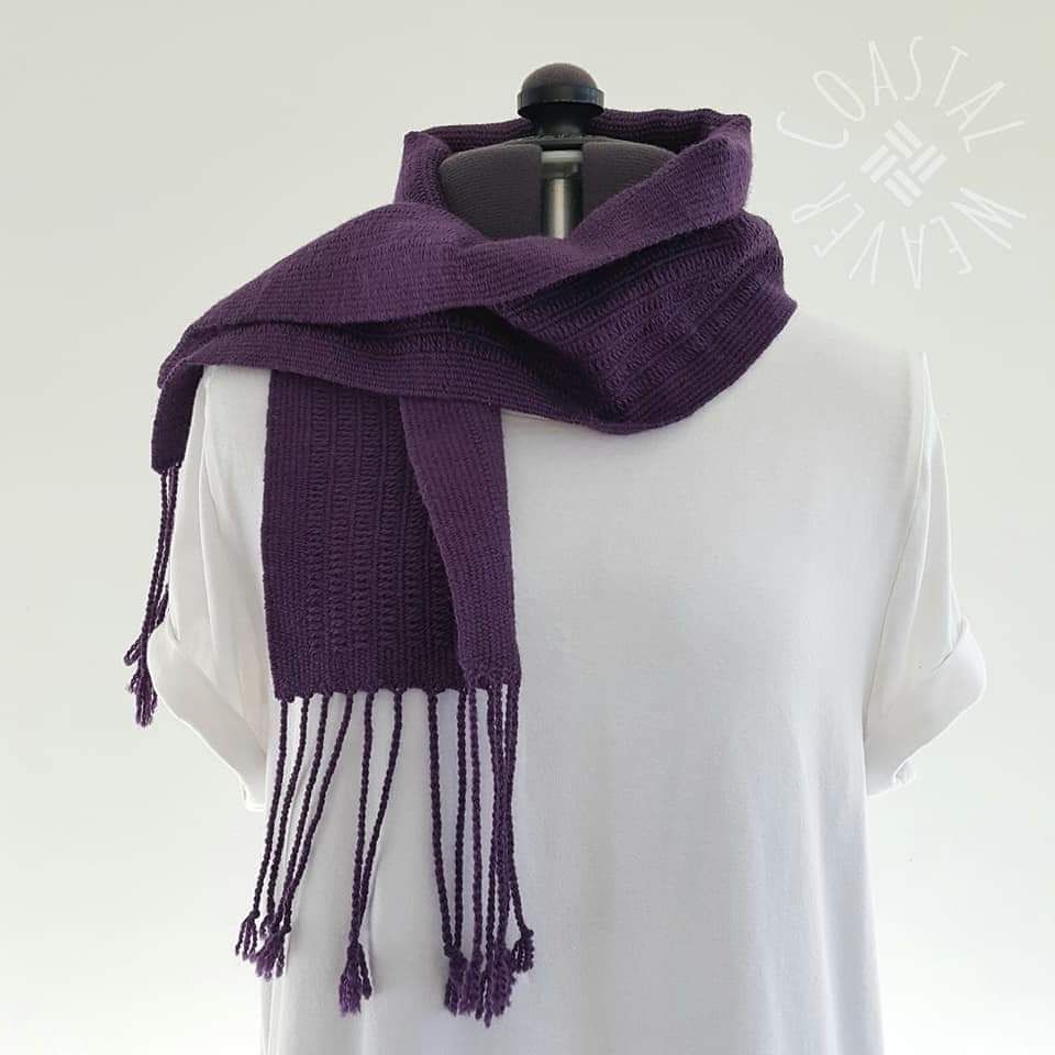 Hand woven scarf with pick up stick pattern.