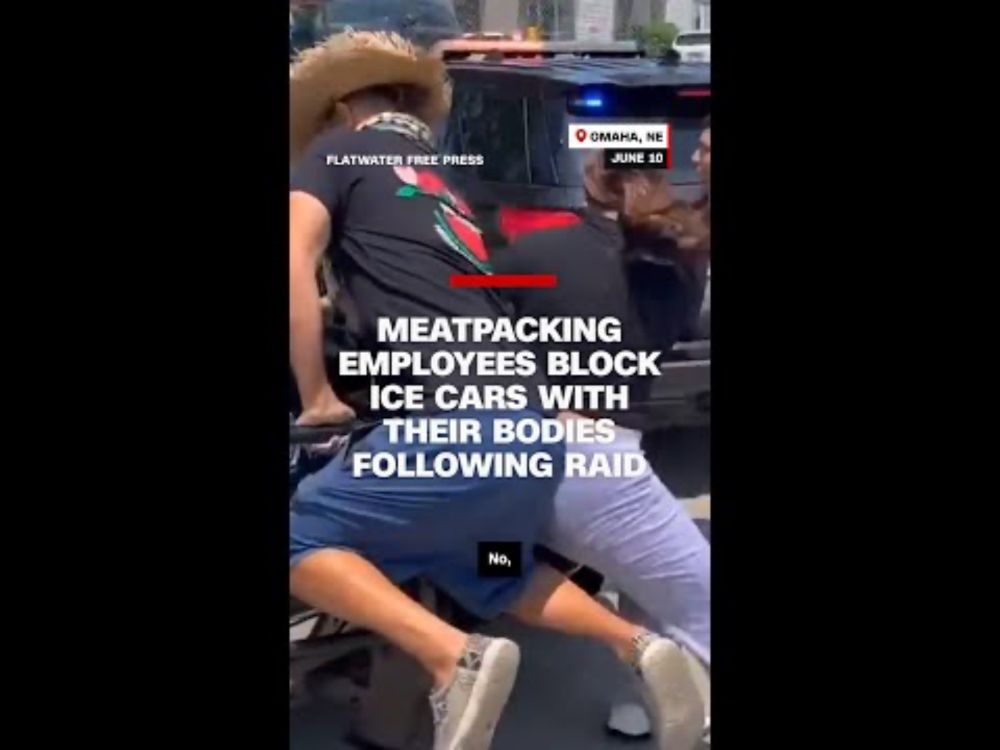 Meatpacking employees block ICE cars with their bodies following raid