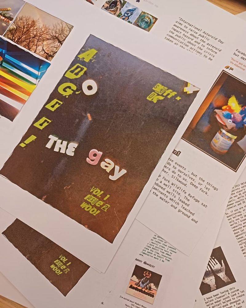 AnGrr! Zine pages sneak peak spread artfully on a table 