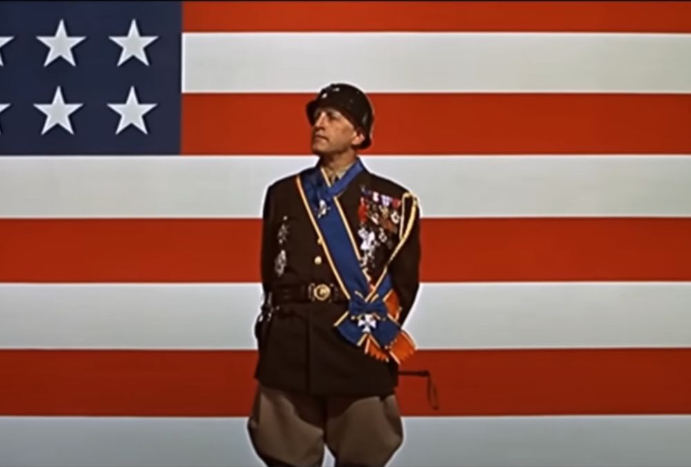 Screen Capture of the introduction speech in the movie "Patton" 1970 with the same flag background Bronzolini & Kegsbreath just used.