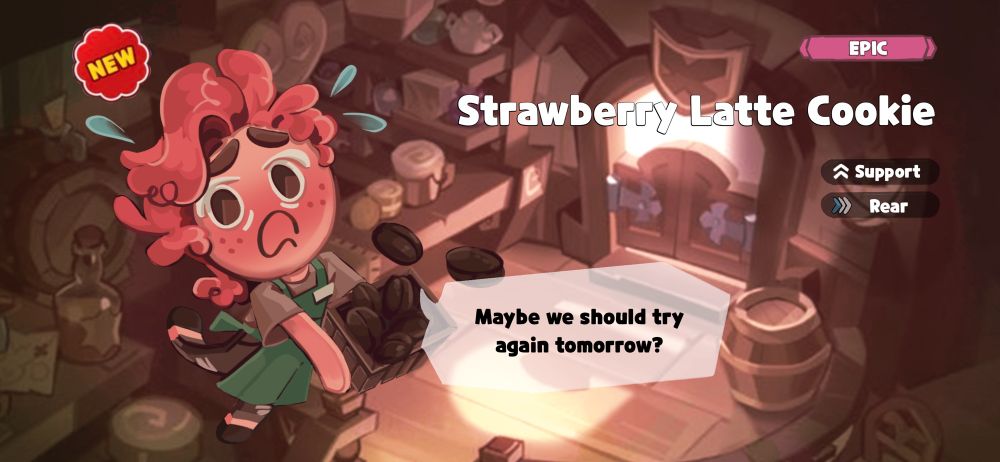 felix as a strawberry latte cookie in cookie run kingdom, he has pink hair and blushed skin, he is wearing a light brown shirt and green apron and brown jeans, in his hands he is spilling a box of coffee beans on the side he is labeled as a support cookie and in the rear (in terms of game mechanics)