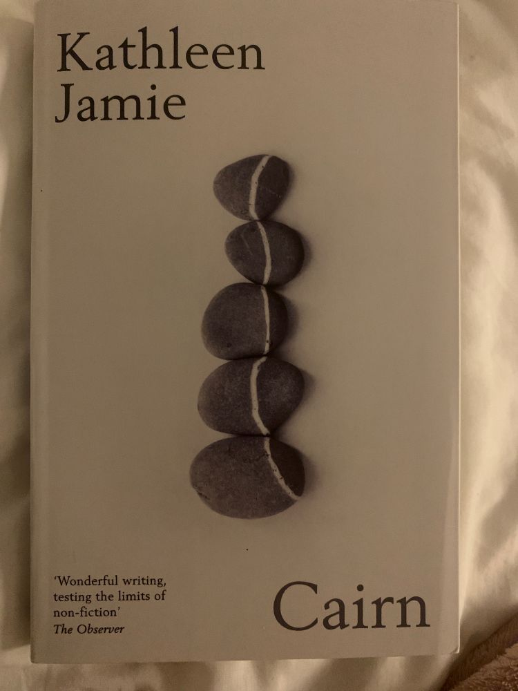 Grey stones laid out so the white lines in each stone connect as a through line. 