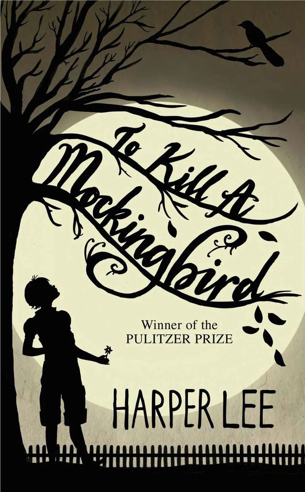 Picture of a paperback book of To Kill a Mockingbird by Harper Lee. Black and ivory illustration of a girl standing under a tree that has a bird in the branches.