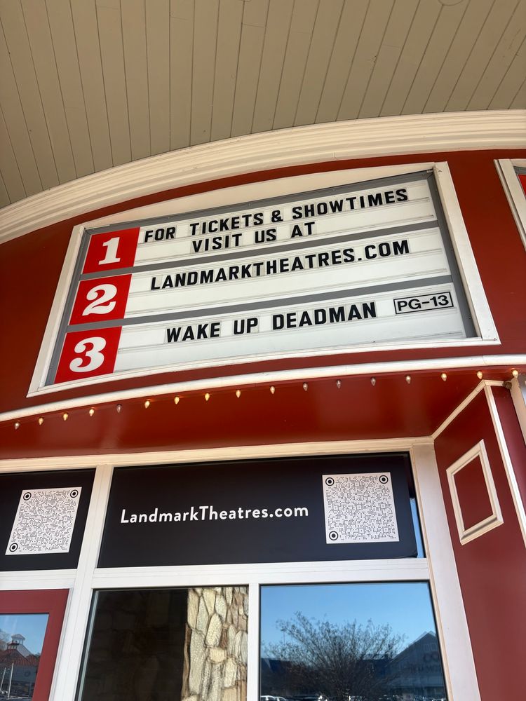 a theater marquee showing wake up dead man