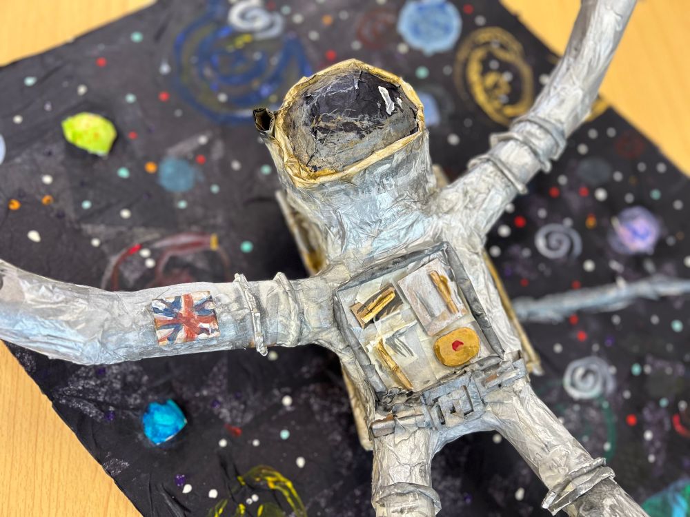 One of the 3D astronaut sculptures created by the Year 6 pupils from Greenfield Primary School. These have been built from scrap cardboard and paper straws,covered with a layer of papier mache and then painted. 