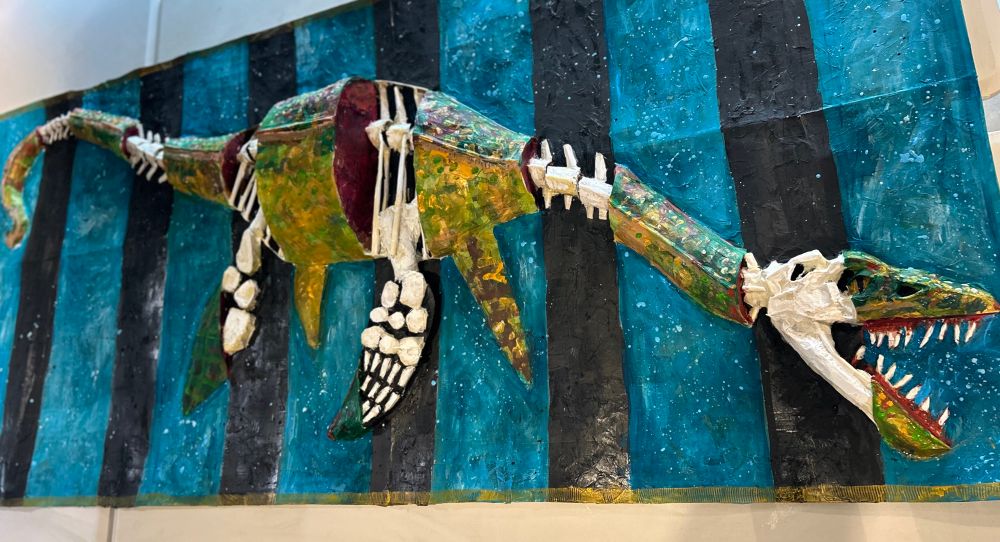 The finished artwork from 2 days at the Market Hall Museum. The visiting children created a 3D model based on a fossil Plesiosaur from the museum. The image shows the creature, but with sections blacked out like an x-Ray, to highlight the bones underneath. 