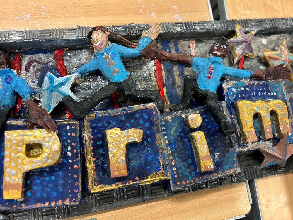 Close up photo of the small models of children created for the display. 
