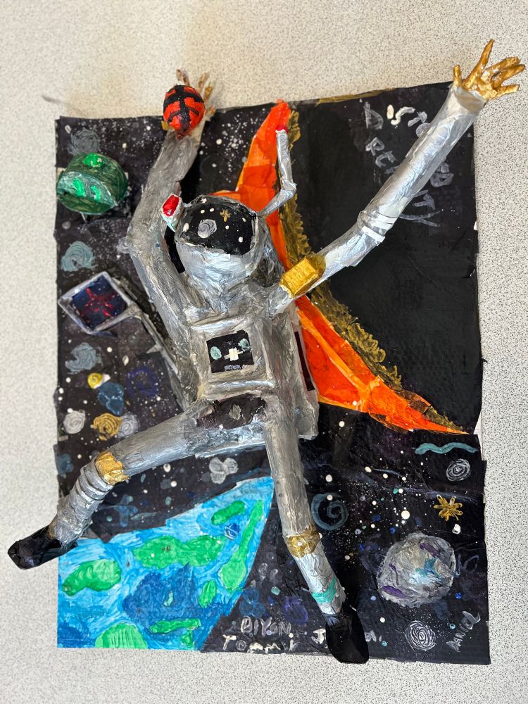 One of the 3D astronaut sculptures created by the Year 6 pupils from Greenfield Primary School. These have been built from scrap cardboard and paper straws,covered with a layer of papier mache and then painted. 