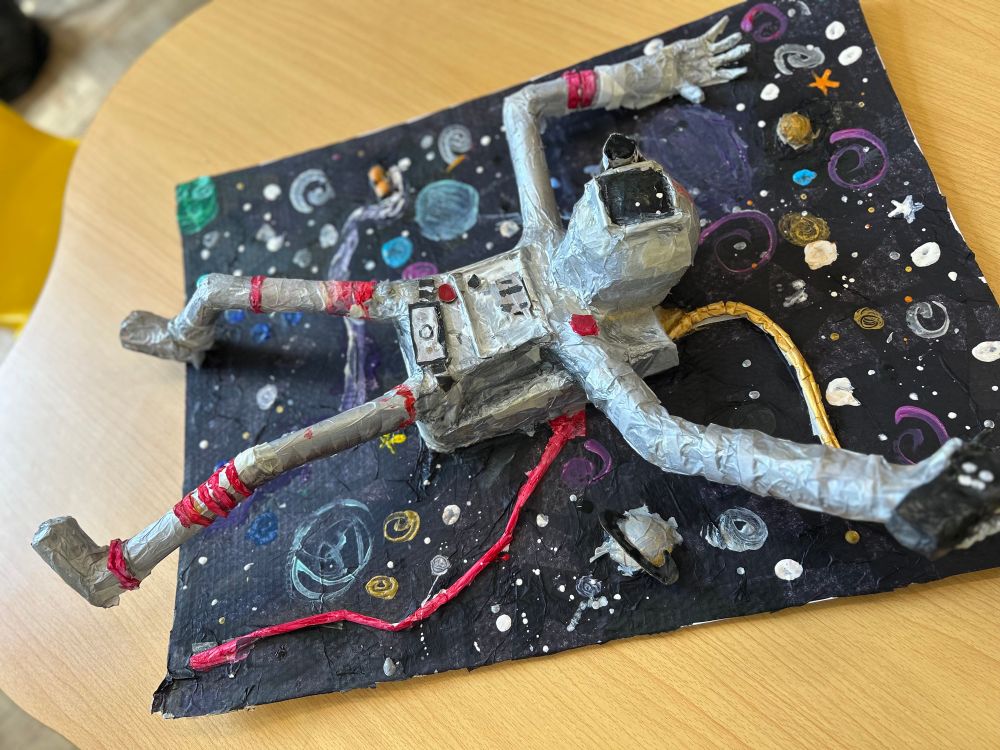 One of the 3D astronaut sculptures created by the Year 6 pupils from Greenfield Primary School. These have been built from scrap cardboard and paper straws,covered with a layer of papier mache and then painted. 