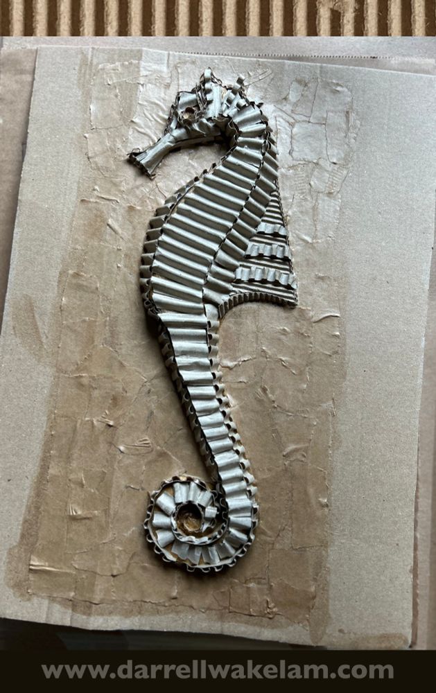 A seahorse sculpture made from scrap corrugated cardboard. 