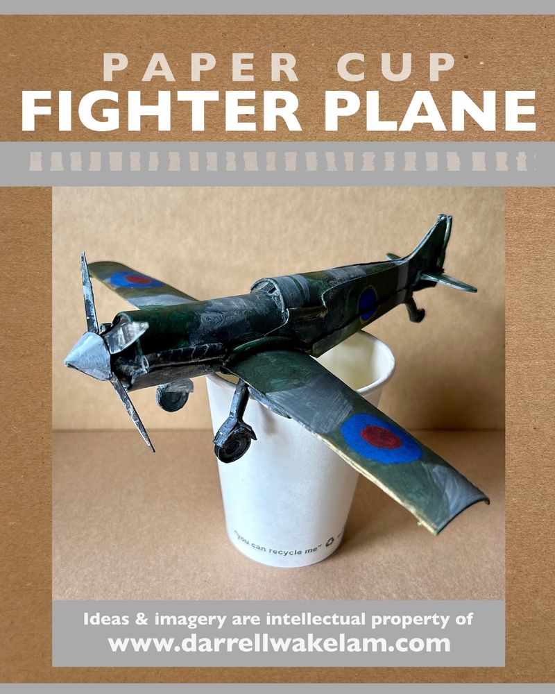 My paper cup plane design. This small fighter plane is mad entirely from pieces of recycled coffee cups. In the photo the plane model is sat on top of one of the paper cups. 