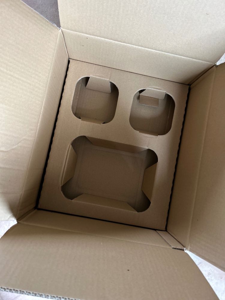 a photo of a parcel I've just had delivered where the packaging looks just like a shocked face. 