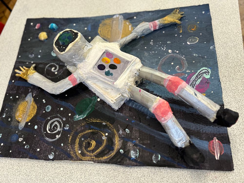 One of the 3D astronaut sculptures created by the Year 6 pupils from Greenfield Primary School. These have been built from scrap cardboard and paper straws,covered with a layer of papier mache and then painted. 