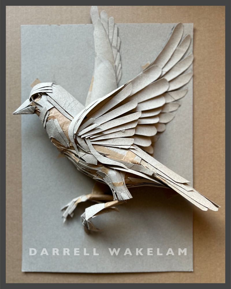 A bird made entirely from recycled cardboard tubes 